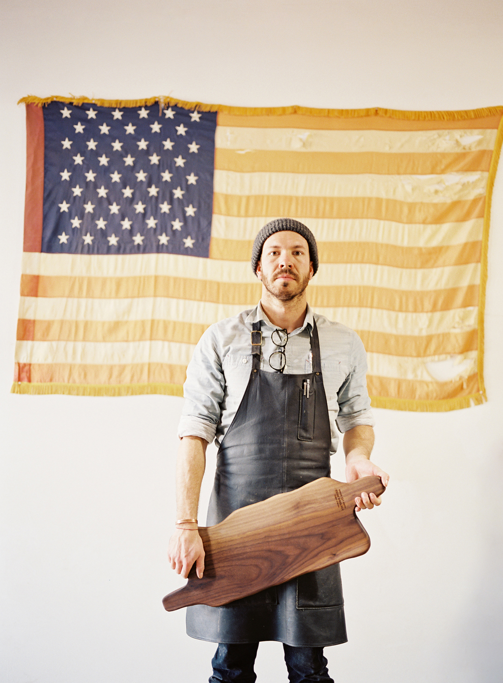 Sean woolsey standing in front of american flag