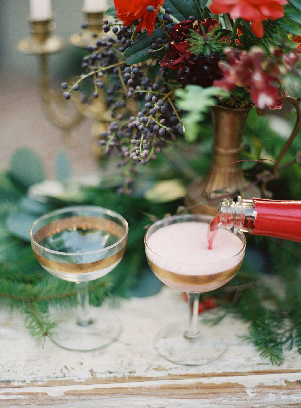 pouring champagne for a winter theme styled shoot in Orange County