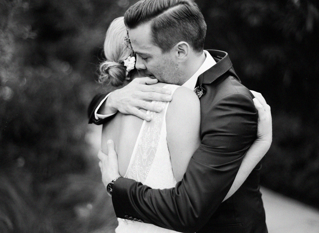 emotional black and white photo of a bride and groom