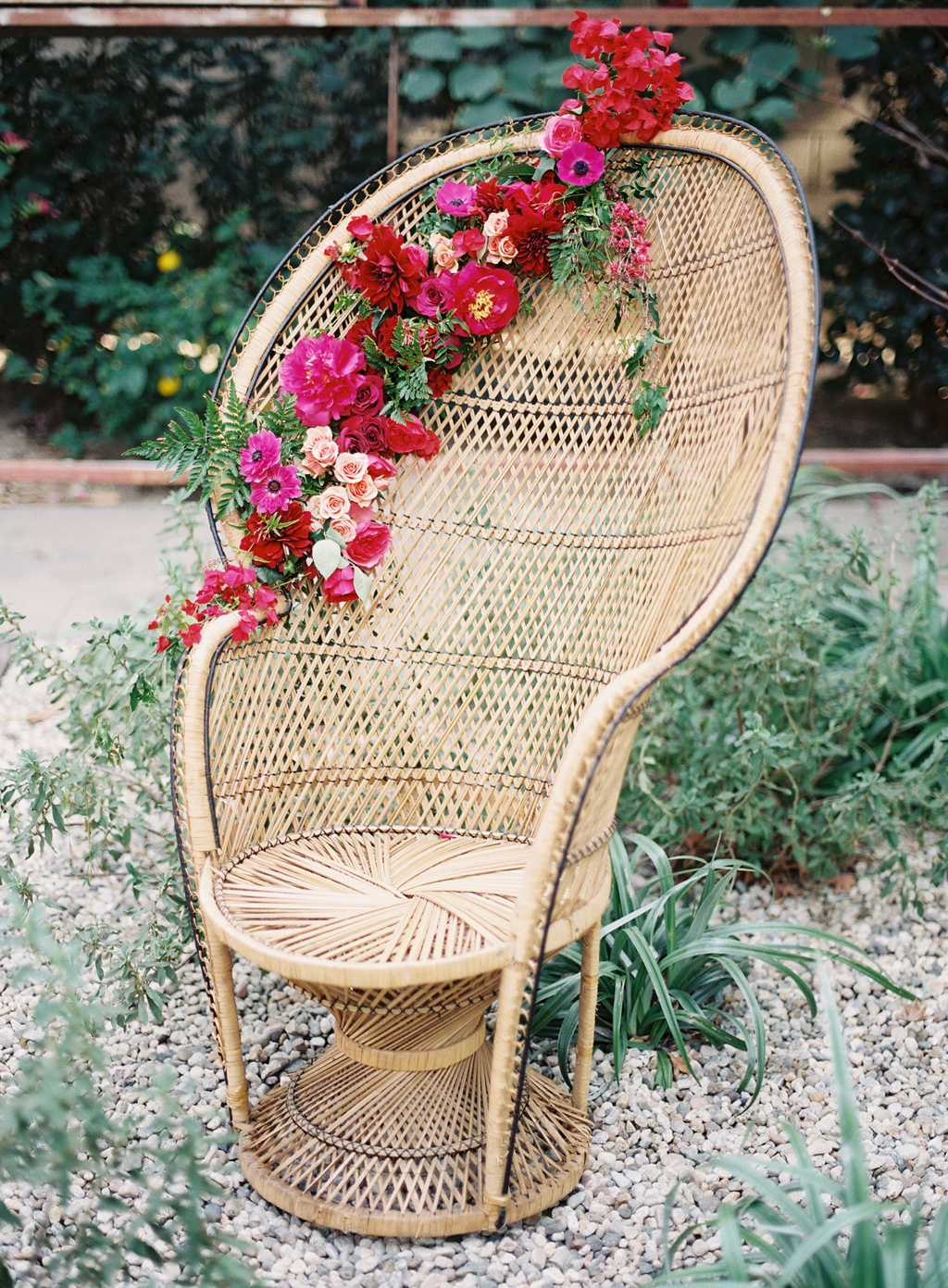 peacock chair decorated with flowers by Hello Gem events