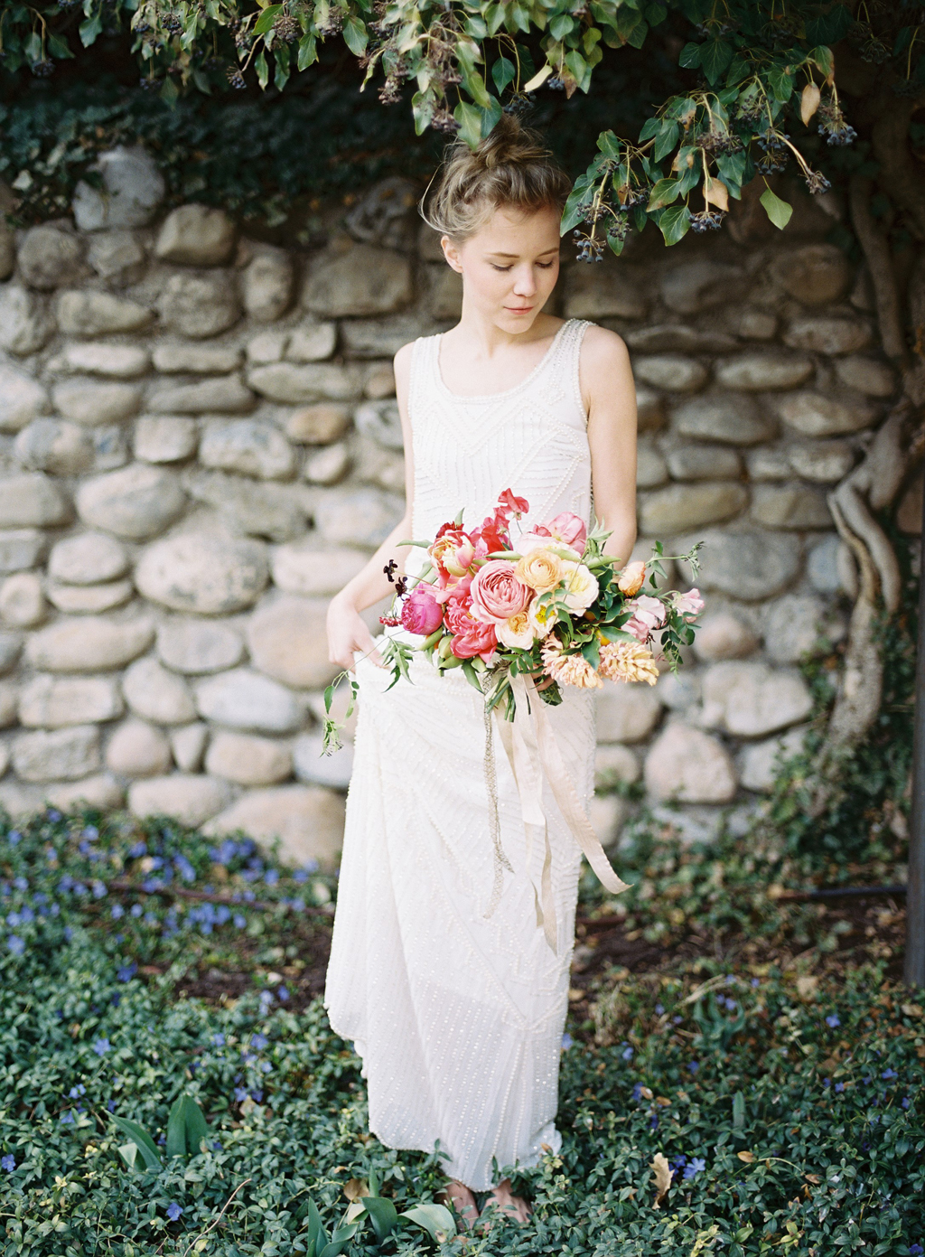 film portrait of a bride holding her bouquet by tinge during her wedding in Utah