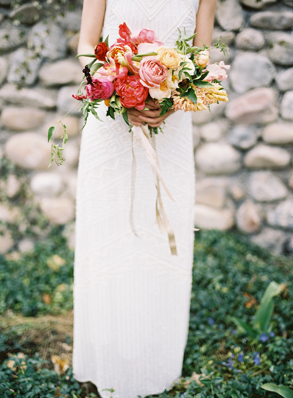 a summer citrus inspired wedding bouquet by ashley beyer of tinge, photographed by film photographer michael radford
