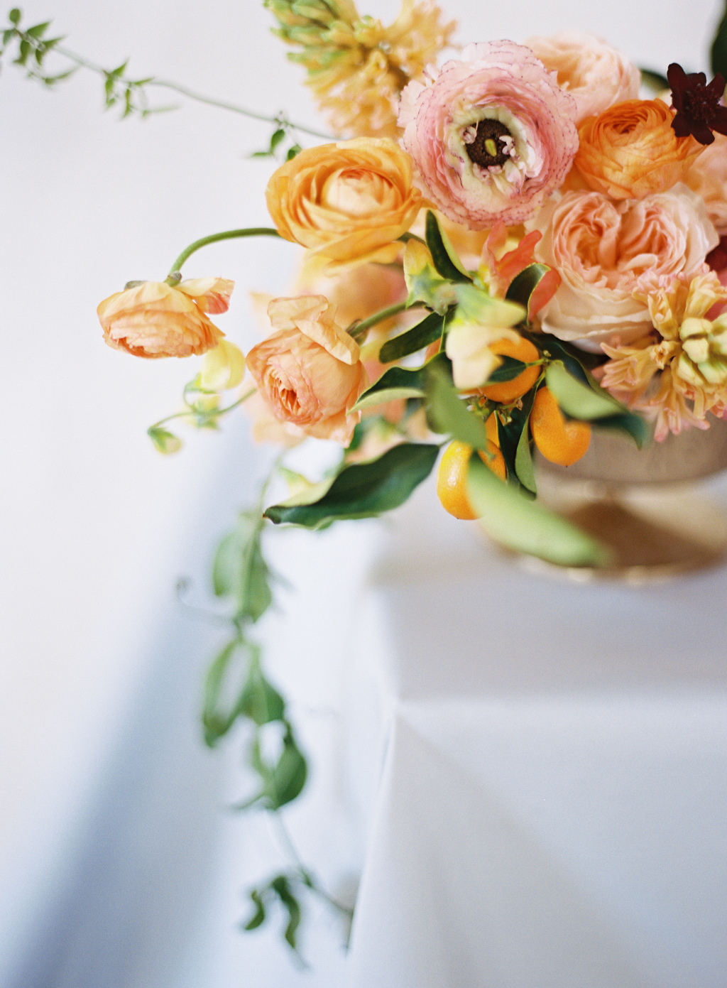 a detail photograph of a wedding floral centerpeice by ashley beyer of tinge