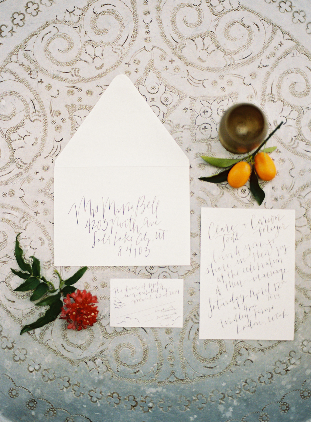 a wedding invitation suite with calligraphy by tessa shane