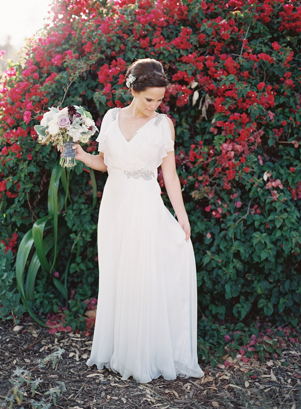 A southern california bride posing on her wedding day in Orange county