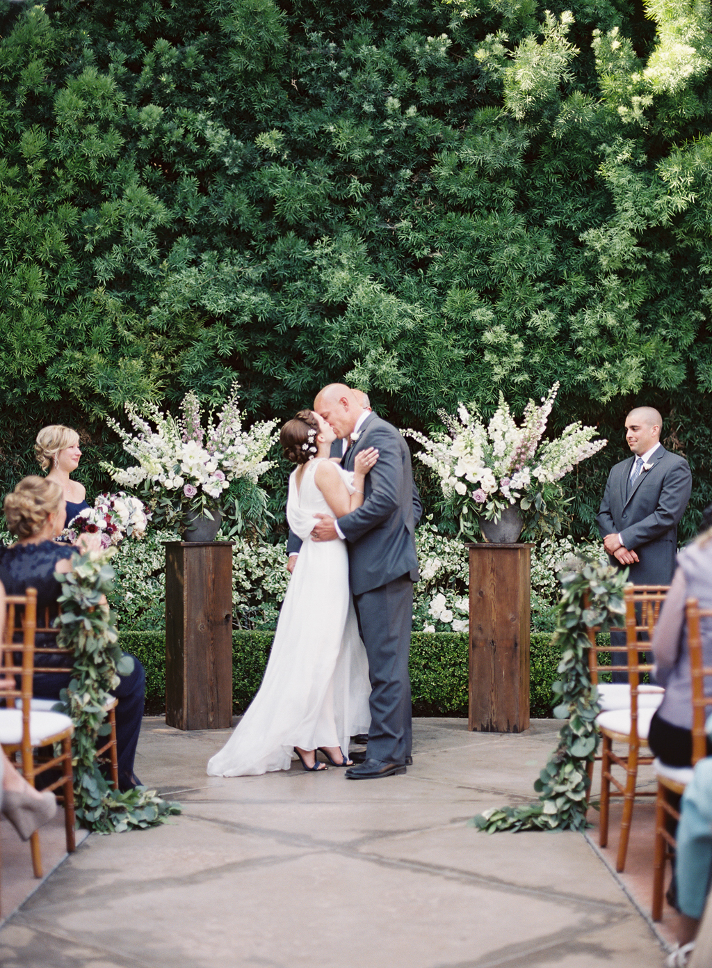 a southern california bride and groom's first kiss at their wedding in orange county