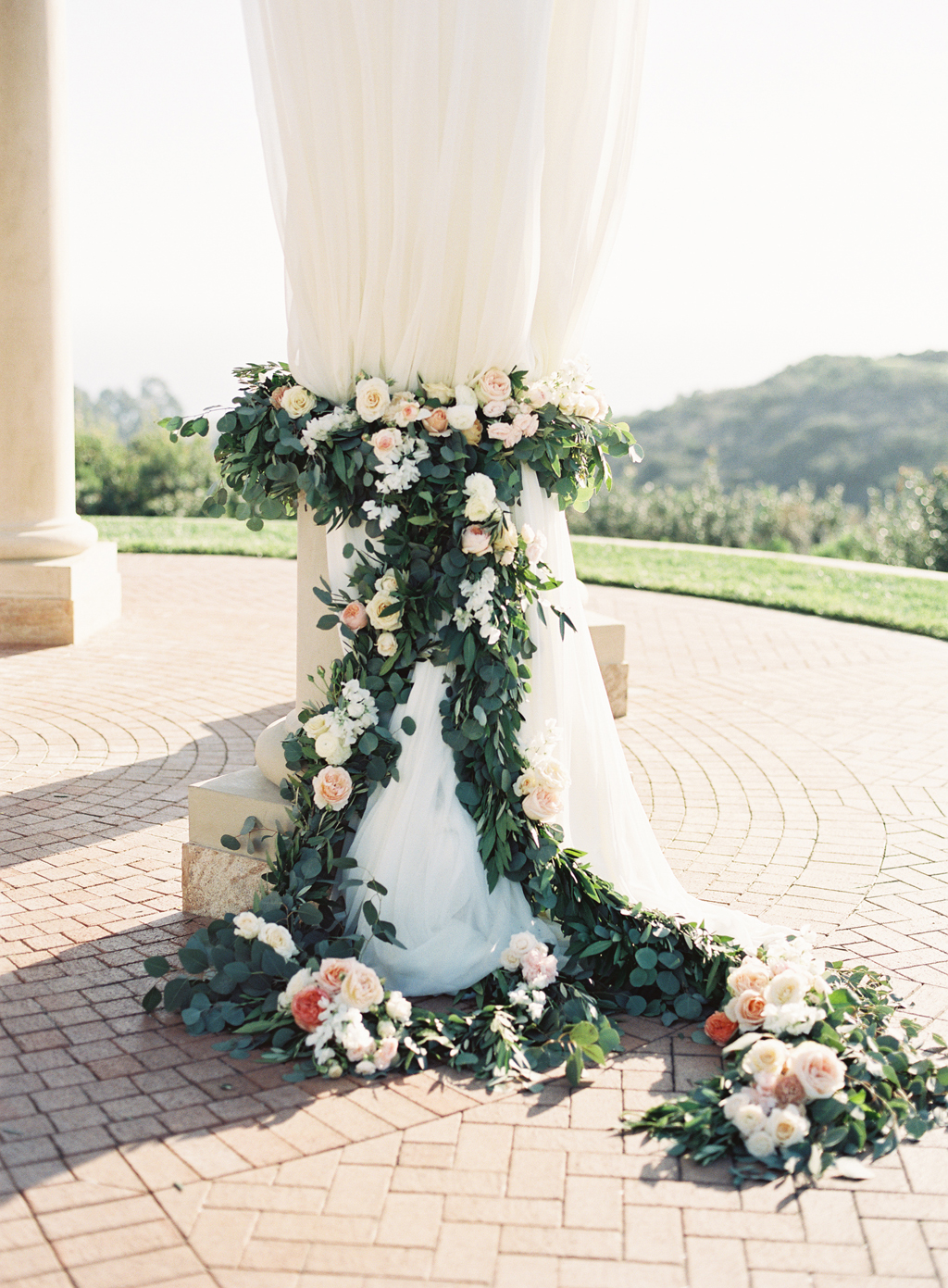 a film photograph of ceremony florals by art with nature.