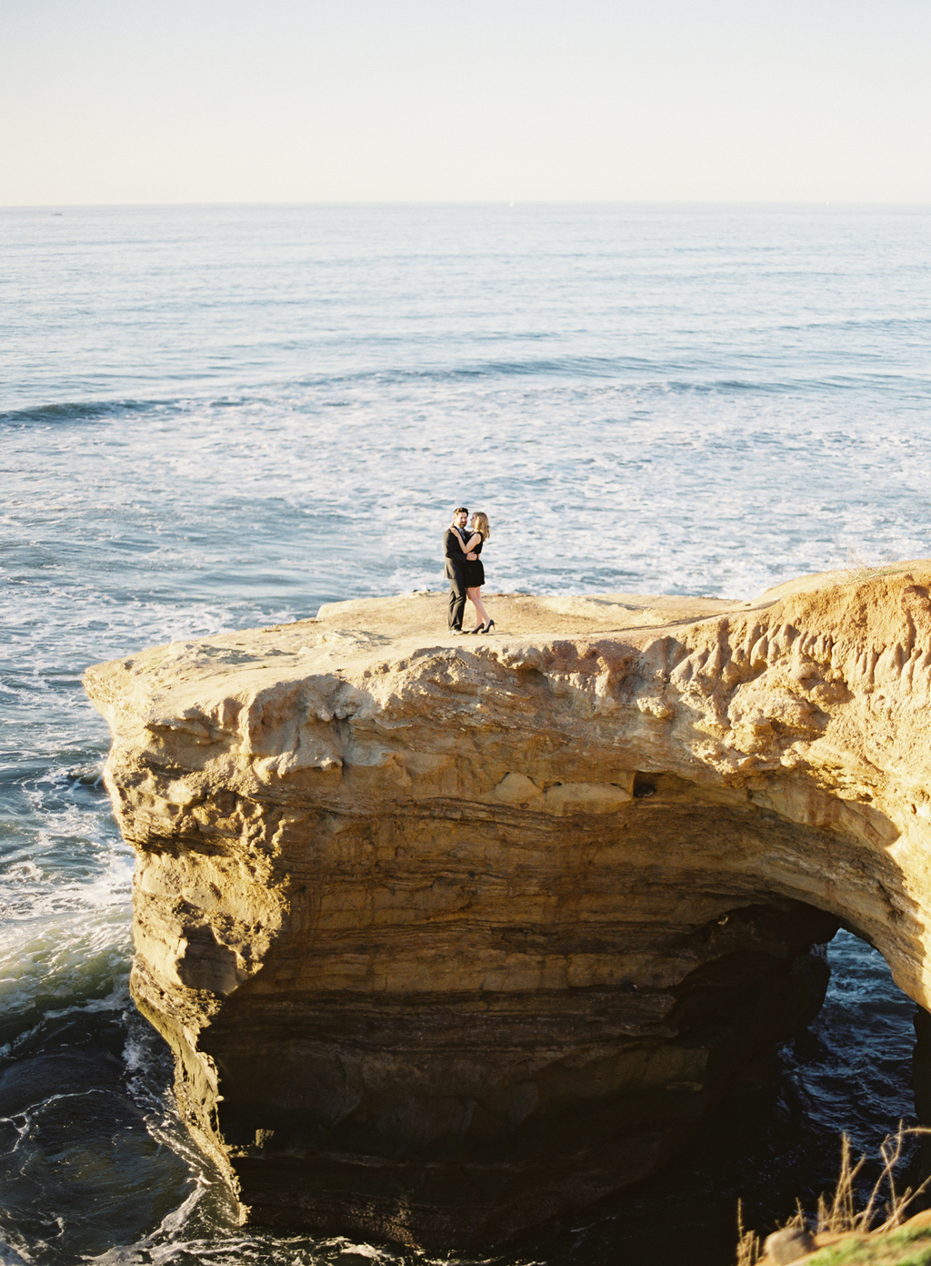 a southern california engagement session captured on film along the coast.