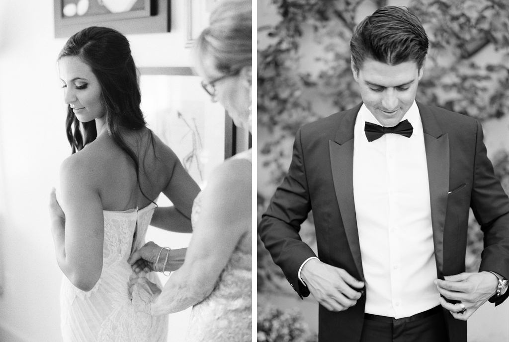 a black and white photo of a bride getting her dress on and a groom buttoning his suit on their wedding day in Napa valley California wine country. 