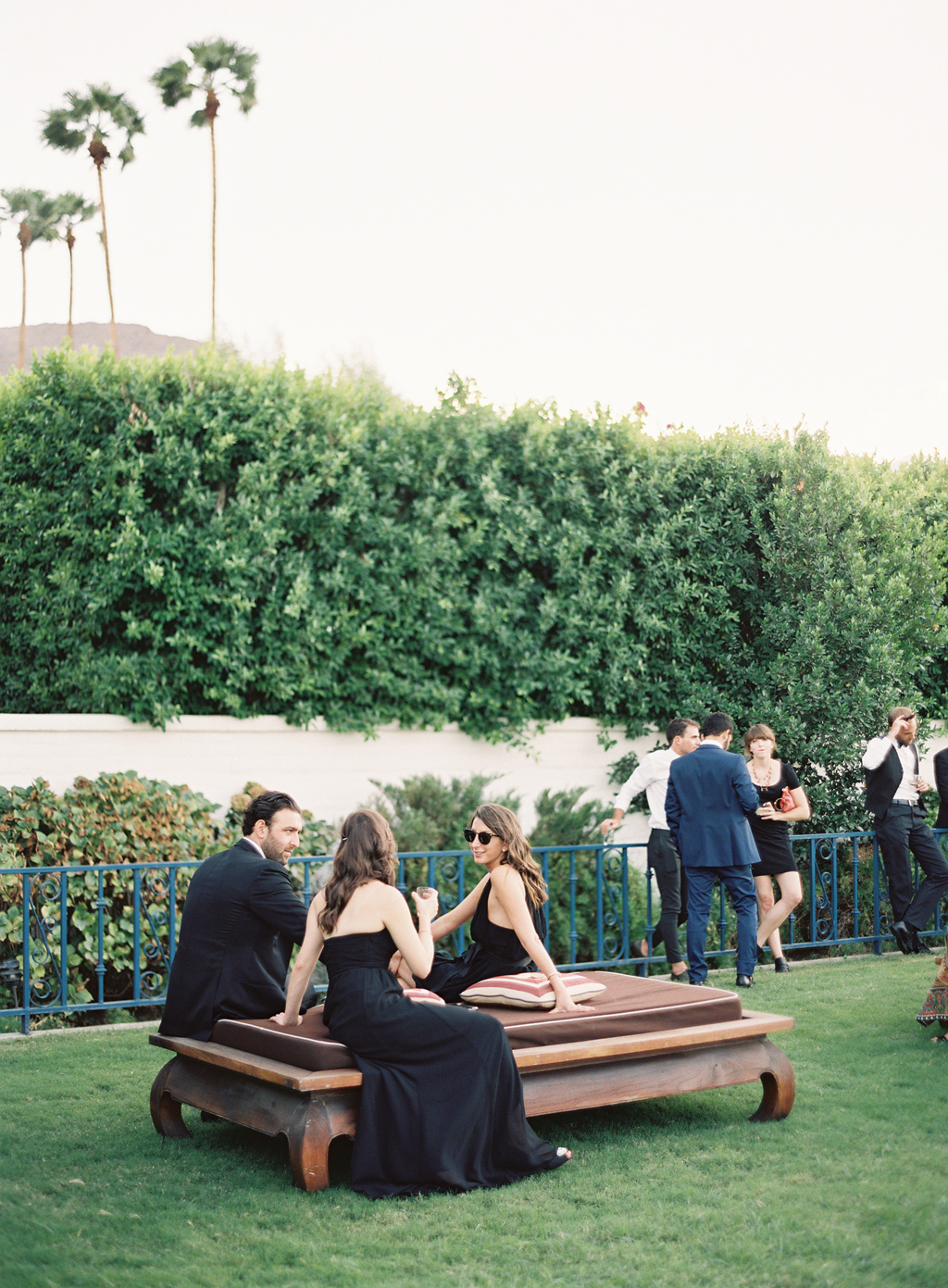 guests lounging during cocktail hour at a wedding in Palm Springs. 