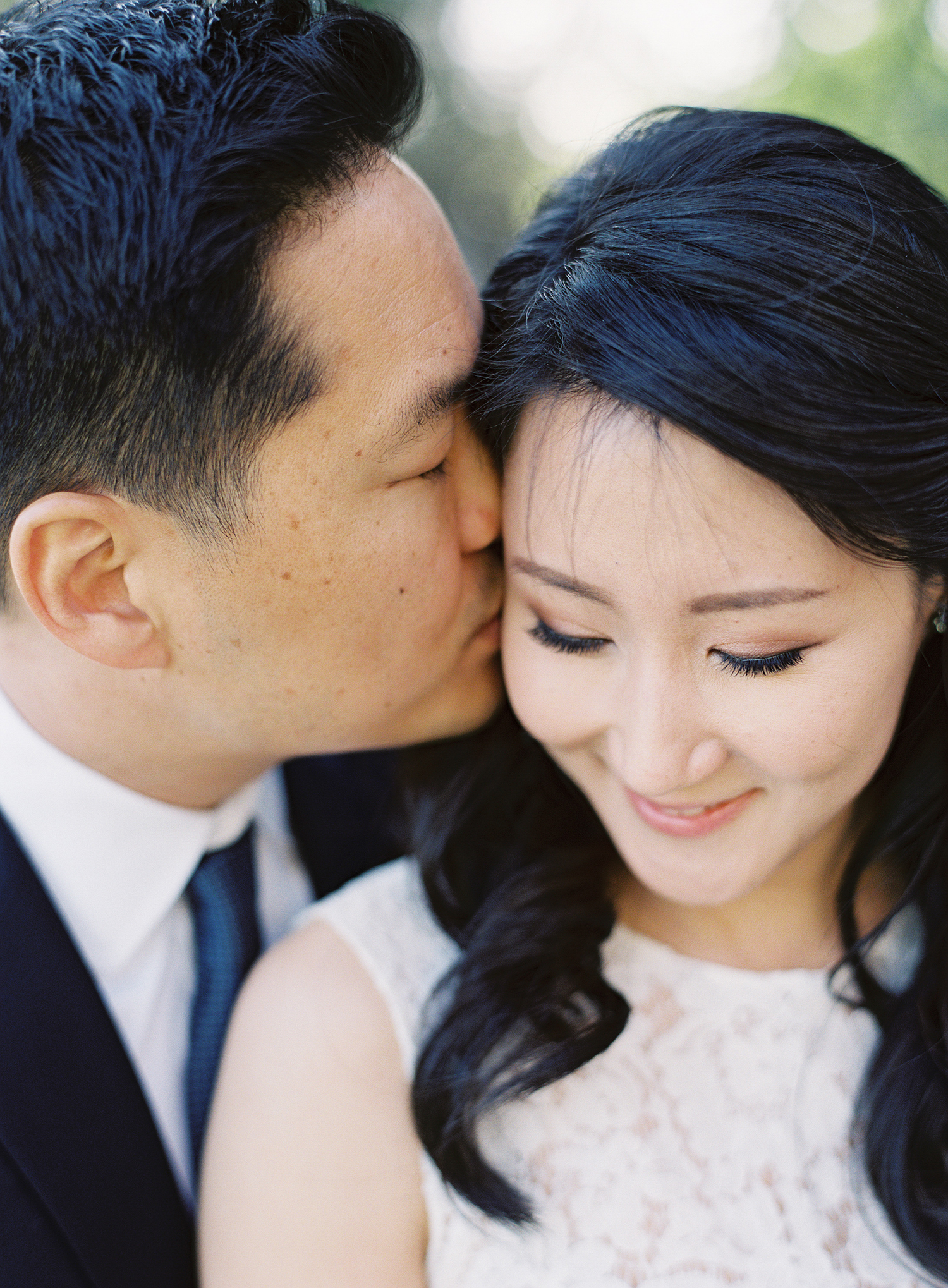a close up photograph of a couple during their engagement session at greystone mansion in southern california.